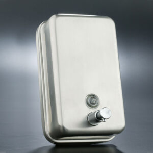 Vertical satin stainless steel soap dispenser with 1.2-liter internal tank, chrome valve, lock, and viewing window for public and professional restrooms.