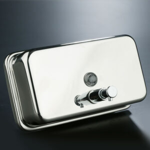 Wall-mounted horizontal soap dispenser made of polished stainless steel with 1.2L plastic tank, chrome valve, and key-lock closure for professional use.